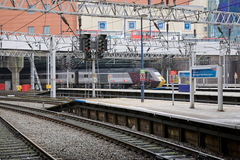 43285, XC 11.11 Leeds-Plymouth (1V54), Birmingham New Street station 
 43285 leads the Cross Country 11.11 Leeds to Plymouth into Birmingham New Street station. This HST power car was built in 1978 and then entered use on the Eastern Region as part of set 254015. In 2008 it was renumbered 43285 and is now in use with Cross Country. I like this livery, it maintains a relatively modern look for these veterans of the network. 
 Keywords: 43285 11.11 Leeds-Plymouth 1V54 Birmingham New Street station