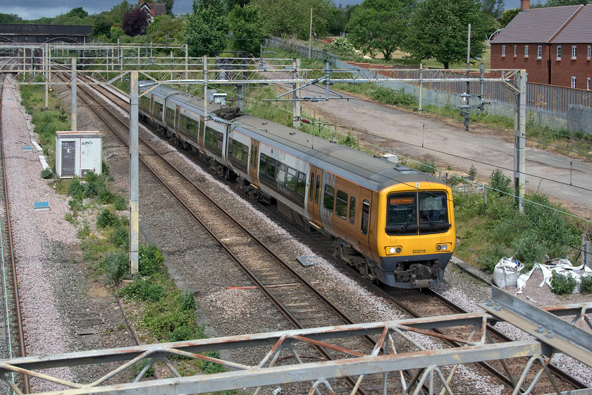 323210, 10.49 Soho TMD-Wolverton Centre siding (5Z23, 4E), site of Roade station 
 In a brief glimpse of sunshine with threatening black clouds overhead West Midlands Railway's 323210 nears journey's end as it passes Roade running as the 10.49 Soho MPD to Wolverton Works. It's strange that this unit is returning to the Wolverton facility as it visited only three weeks ago, see.... https://www.ontheupfast.com/p/21936chg/29028474804/x323210-11-05-soho-lmd-wolverton I wonder if this second trip was planned or because something was not right when it was released the first time round? 
 Keywords: 323210 10.49 Soho TMD-Wolverton Centre siding 5Z23 site of Roade station West Midlands Railway WMR