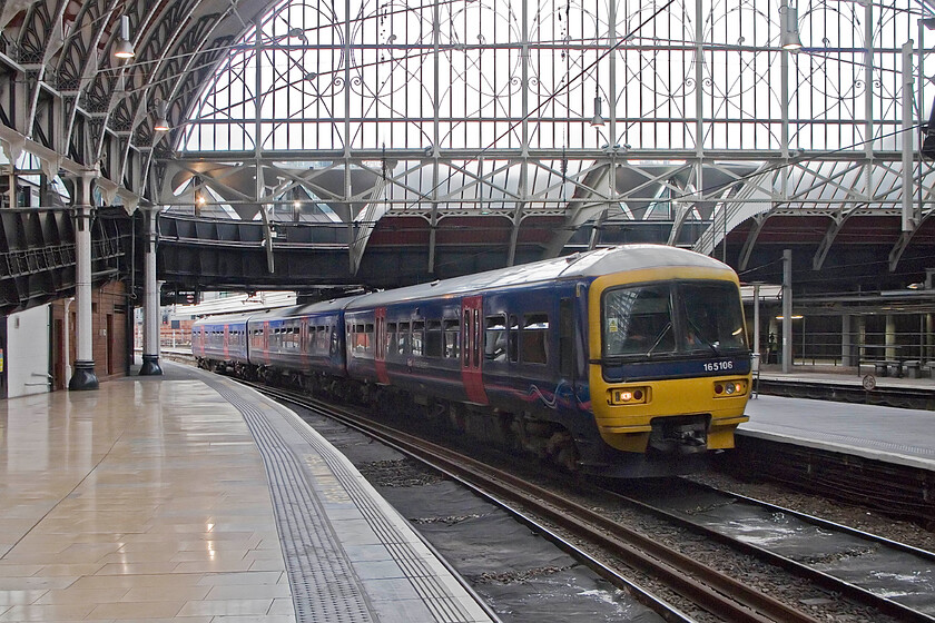 165106, GW 12.07 Oxford-London Paddington, London Paddington station 
 The 12.07 Oxford to Paddington FGW service arrives at its destination worked by 165106. These units have just passed their twentieth year in operation but their time is limited now with the forthcoming electrification likely to precipitate their withdrawal or cascade to other areas. 
 Keywords: 165106 12.07 Oxford-London Paddington London Paddington station FGW First Great Western Thames Turbo