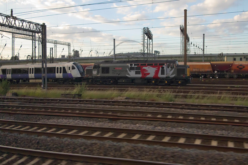 345030 37800 stabled Wembley Yard 
 With Wembley stadium in the background, 37800 'Cassiopeia' stands at the head of one of the new Crossrail units 345030. Not a great shot but a record of the new stock before introduction into service. 
 Keywords: 345030 37800 stabled Wembley Yard