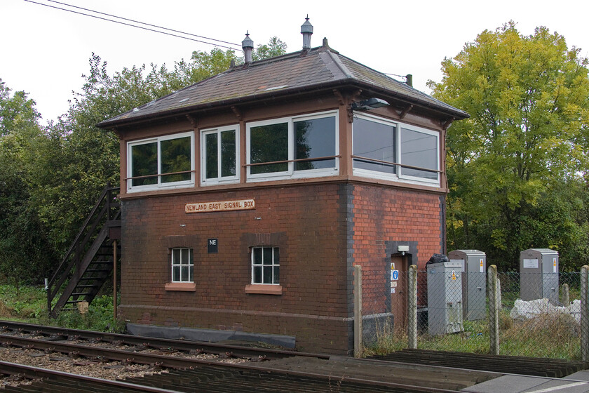 Newland East signal box (GW, 1900) 
 The 1900-built Great Western Type 7A signal box, Newland East was named Stocks Lane between 1929 to 1943. Today, whilst it still stands and operates a small number of semaphores, its looks have been rather crassly altered by the installation of huge single-pane UPVC glazing units. Slightly further towards Great Malvern there was a Newland Weest signal box that was closed and demolished in the early 1960s. It was opposite the Newland gasworks and controlled a number of sidings that also saw use as PW sidings into the 1980s after the closure of the gasworks control of which changed to the East box 
 Keywords: Newland East signal box