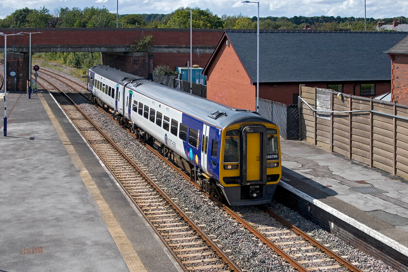 158796, NT 12.57 Sheffield-Scarborough (1W45, RT), Bridlington station 
 Taken from Bridlington's temporary footbridge 158796 arrives with the 12.57 Sheffield to Scarborough service. Andy and I travelled aboard this very busy (and noisy!) train to its destination. The last time I saw this unit was on the other side of the country in a very different environment and I was also with Andy then, see..... https://www.ontheupfast.com/p/21936chg/30016458800/x158796-12-49-leeds-carlisle-2h88 
 Keywords: 158796 12.57 Sheffield-Scarborough 1W45 Bridlington station