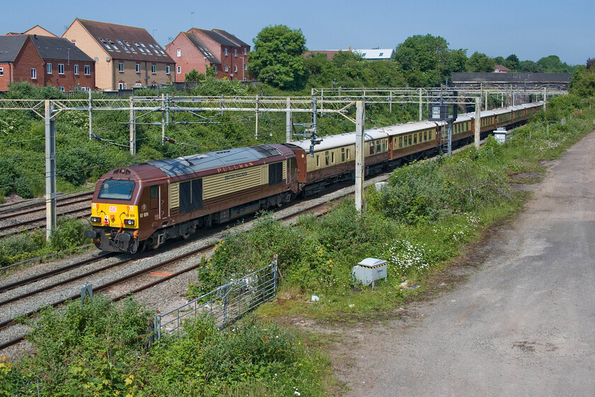 67024, 08.43 Stewarts Lane-Hamilton EG Steel (5Z60, 7E), site of Roade station 
 Taking a trip to Scotland 67024 is seen at the rear of the 5Z60 08.43 Stewarts Lane to Hamilton EGS empty stock working. The train is seen passing the site of Roade's station on a glorious June morning...has summer arrived at last? 
 Keywords: 67024 08.43 Stewarts Lane-Hamilton EG Steel 5Z60 site of Roade station Belmond Pullman