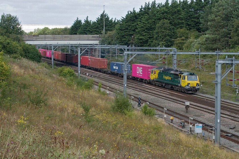 70010, 09.52 Lawley Street-Southampton MCT (4O38, 2E), Loughton Redway bridge, Milton Keynes 
 With the closure, yet again, of the line through Oxford due to troubles with the extension of the station and the remodelling of the Botley Road underbridge freight was being diverted along the already busy WCML. 70010 leads the 09.52 Lawley Street to Southampton MCT Freightliner service on the approach to Milton Keynes taken from the Loughton Redway bridge. 
 Keywords: 70010 09.52 Lawley Street-Southampton MCT 4O38 Loughton Redway bridge, Milton Keynes