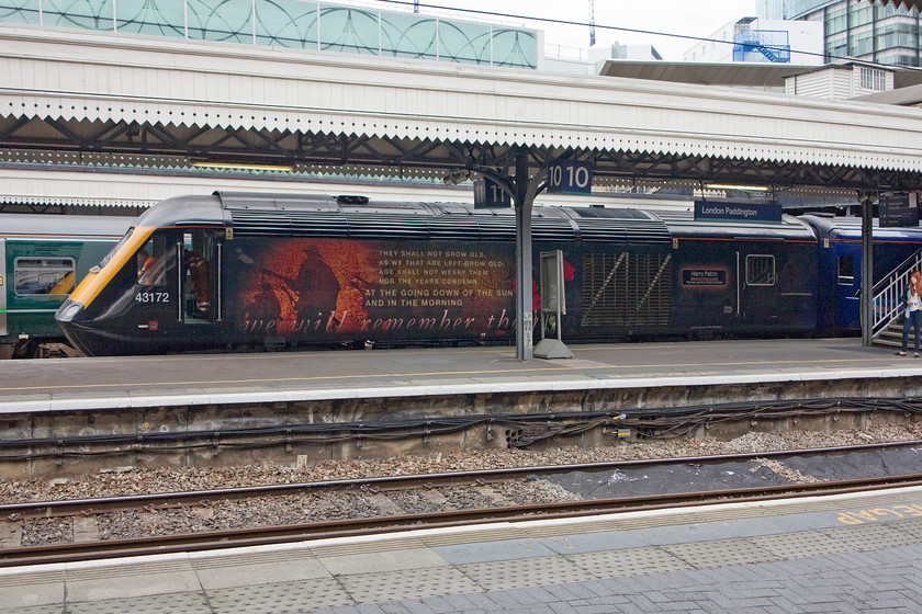 43172, GW 11.28 Swansea-London Paddington (1L55), London Paddington station 
 The impressive vinyl graphics applied to the side of 43172 'Harry Patch - The last survivor of the trenches' are seen to full effect at Paddington station. Unfortunately, the power car was giving trouble and a couple of engineers are seen trying to sort the problem out. The HST had just arrived having worked the 11.28 from Swansea. 
 Keywords: 43172 11.28 Swansea-London Paddington 1L55 London Paddington station