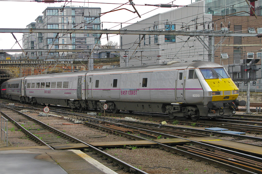 82210, GR 10.03 York-London King`s Cross (1Y82), London King`s Cross station 
 Emerging from Gasworks Tunnel at the end of its journey, the 10.03 from York arrives at King's Cross with 82210 leading. The train is still branded as East Coast, the state-owned operator controlled, albeit at a very long arm's length, by the Department of Transport. This TOC ceased its operations from the first of last month (March). 
 Keywords: 82210 10.03 York-London King`s Cross 1Y82 London King`s Cross station