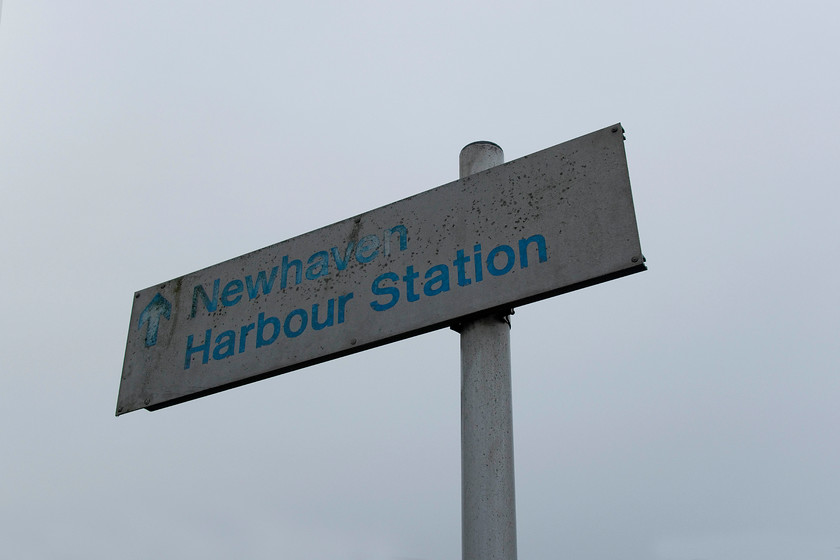 Sign, Newhaven Marine station 
 A rather faded BR (NSE) sign directing passengers to Newhaven harbour station. It is situated on the end of the old platform of the former, and now demolished, Newhaven Marine station. No passengers have been directed by this sign for many years with the last public train using the station in August 2006 with the exception of the Parliamentary Train and ECS moves. 
 Keywords: Sign Newhaven Marine station