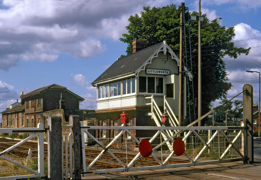 Littleworth signal box (GN, 1875) 
 Littleworth signal box and its associated gates look superb in the morning sunshine with the former station (closed 15.06.64) seen in the background. The Great Northern box opened in 1875 and was of their standard and ornate design at the time that I cannot help but feel would have made them relatively expensive to construct. The box was subject to the early replacement of its windows with upvc units already installed but the mechanical gates survived until the mid 1990s. At the time of writing the box still stands following its closure in 2014 and appears, according to recent observations, to be in receipt of some upkeep. However, with the access steps removed this work is made a little more complicated! 
 Keywords: Littleworth signal box