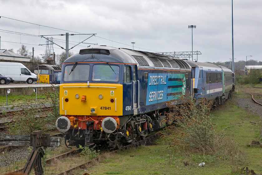 47501 & 47841, stabled, Norwich yard 
 In recent years the yard to the west of Norwich station's platforms has become synonymous with a collection of vintage locomotives assisting Great Anglia with their chronic shortage of units that has been on-going for a number of years now. DRS have been the providers of the motive power and stock used that, between services, is found scattered around the sidings. The DVT and the Mk. II coach seen here are not part of the DRS portfolio wearing the older Greater Anglia livery are probably stabled due to a fault. To the far left by the Transit van is 47501 'Craftsman' with 47841 in the foreground. 
 Keywords: 47501 47841 stabled Norwich yard DRS Direct Rail Services Craftsman