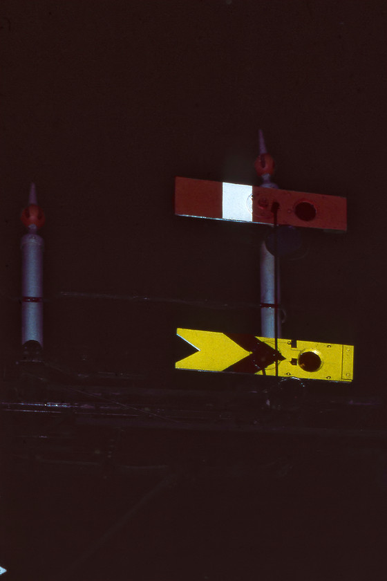 Up starter bracket signal, Frome station 
 When Frome South signal box was closed in 1970 control of all signalling was moved to the nearby Frome North box. This control included the up bracket signal at the platform end as seen here. Even in 1980, this was a very rare type being a double centre pivot wooden example. The doll to the left once contained the starter arm for the Radstock bay platform that had been out of use for many years. Due to its historical imp[ortance, this complete signal still exists today at the National Railway Museum in York being rescued when resignalling came to Frome in1984. I took a photograph in the daylight of the signal a couple of years earlier, see..... https://www.ontheupfast.com/p/21936chg/25473984004/up-starter-bracket-signal-frome 
 Keywords: Up starter bracket signal Frome station semaphore wooden arm