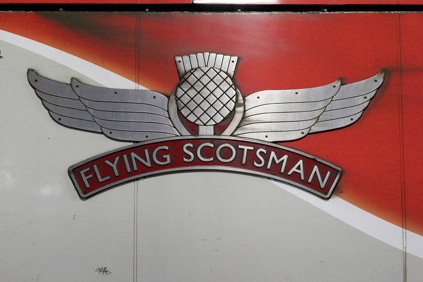 Nameplate & crest, 91101, GR 18.00 London King`s Cross-Edinburgh Waverley (1S28, 17L), London King`s Cross station 
 The lovely cast nameplate and crest attached to the side of 91101 as it stands at King's Cross station. When this locomotive is taken out of service in the next couple of months, I wonder what will happen to this, and the rest of the nameplates attached to the 91s? Perhaps they could be auctioned off by the owners with the money going to charities? 
 Keywords: Nameplate crest 91101 18.00 London King`s Cross-Edinburgh Waverley 1S28, London King`s Cross station Flying Scotsman LNER