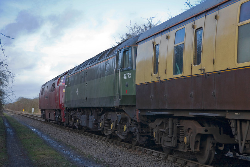 D1015 & 47773, outward leg of The Chiltern Champion 1 (1Z52), 12.40 Marylebone-Oxford, Quainton SP731195 
 At some time in the future (perhaps?) this lonely outpost of a single track deep in the Buckinghamshire countryside will be running cheap by jowl with a two hundred and twenty-five miles per hour double track in the form of HS2. Its proposed route will be just out of shot to the left parallel to the track seen that is the former Great Central route just north of Quainton Road. D1015 'Western Champion' leads 47773 on the return leg of The Chiltern Champion railtour from Marylebone to Oxford via a reversal at Claydon Junction a short distance from this location. When this reversal took place the Western was detached from the front and ran round to the rear to take the train onwards with the 47 at the rear. 
 Keywords: D1015 47773 Chiltern Champion 1 1Z52 12.40 Marylebone-Oxford Quainton SP731195 Western Champion