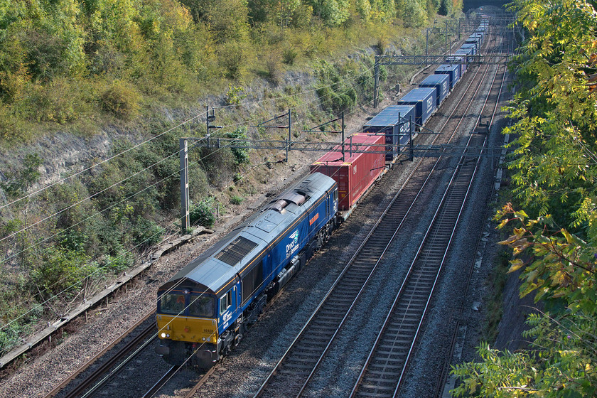 66428, 11.05 Tilbury-DIRFT (10E), Roade cutting 
 Not a DRS Class 66 that I have taken very many photographs of is 66428 'Carlisle Eden Mind'. I last saw it at DRS' Carlisle open day in July 2019 on the day of its naming, see...... https://www.ontheupfast.com/p/21936chg/27161232204/x66428-display-drs-kingmoor. It had been repainted for that event and still looks smart today over a year on as it passes through Roade cutting with the 11.05 Tilbury to DIRFT Tesco express. 
 Keywords: 66428 11.05 Tilbury-DIRFT Roade cutting DRS Direct Rail Services Carlisle Eden Mind