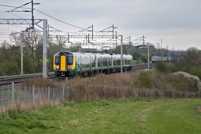 350108, LM 07.46 London Euston-Crewe, Gordon's Lodge SP776483 
 As the 4L97 Trafford Park to Felixstowe Freightliner disappears south the 07.46 Euston to Crewe London Midland service heads north on the down fast past Gordon's Lodge near to Hanslope Junction. London Midland's 350108 is working the Crewe service. 
 Keywords: 350108 07.46 London Euston-Crewe, Gordon's Lodge SP776483 London Midland Desiro