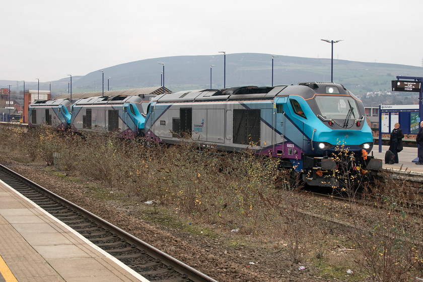 68023, 68027 & 68021, 09.22 York Siemens-Longsight (0M68), Stalybridge station 
 On arrival at Staylbridge station Andy I were greeted by the sight of three TransPennine Express branded class 68s undertaking a test run from York's Siemens dept to Longsight running as 0M68. With the crew standing chatting on the platform, 68023 'Achilles', 68027 and 68021 'Tireless' wait at platform three. Notice the ridiculous and unmanaged growth of scrub in between the running lines. Imagine what this will look like next spring and summer when the full growth takes place. 
 Keywords: 68023 68027 68021 09.22 York Siemens-Longsight 0M68 Stalybridge station