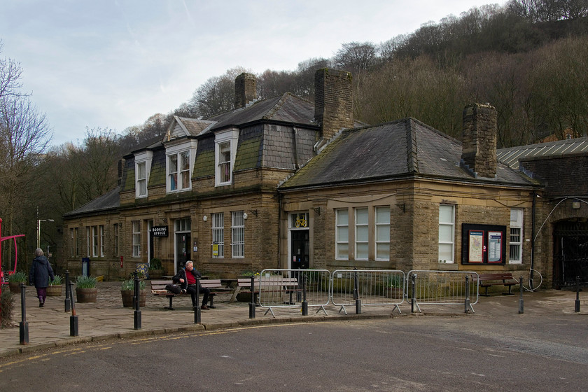 Frontage, Hebdon Bridge station 
 Looking more like an elegant hunting lodge than a station, the lovely frontage of Hebdon Bridge station is seen in this picture. The last picture I took of the station was in the dark one night in December 1985. Then, cars were parked directly in front of the building before it was pedestrianised. This building was opened in 1891 and has served the nearby town since. Andy and I were hoping to try the world-famous caf (as sampled by Michael Portillo) but, unfortunately, it had closed at 14.00. Notice the 'Tour De Yorkshire' yellow bike above the door to the cafe! 
 Keywords: Frontage Hebdon Bridge station