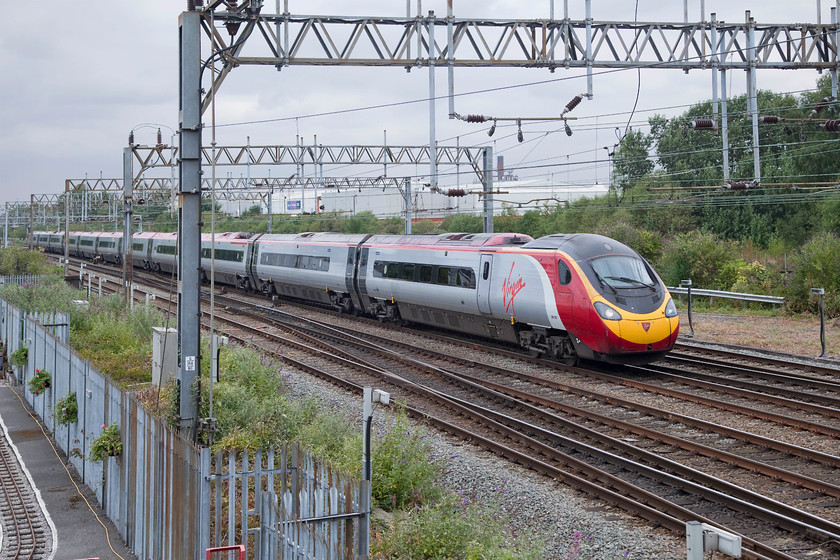 390123, 08.27 Glasgow Central-London Euston (1M9, RT), Roof of Crewe Heritage Centre 
 390123, 'Virgin Glory' approaches Crewe from the north working the 08.27 Glasgow to Euston working. The picture is taken from the useful vantage point atop the Crewe Heritage Centre. 
 Keywords: 390123 1M90 Roof of Crewe Heritage Centre