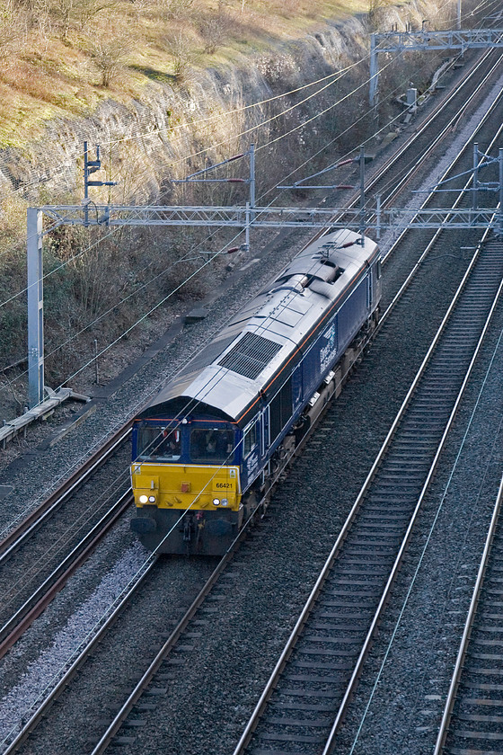 66421, 13.03 Wembley yard-Crewe Gresty Bridge LE, Roade cutting 
 And so we come to my last photograph of 2015! DRS' 66421 passes through Roade cutting as the 13.03 Wembley yard to Crewe Gresty Bridge light engine move. It will be returning to the DRS depot for maintenance and/or stabling. Time to go home, have a cup of tea and get ready to celebrate the end of the year.

To all my readers, have a Happy New Year and here's to 2016! 
 Keywords: 66421 13.03 Wembley yard-Crewe Gresty Bridge light engine Roade cutting