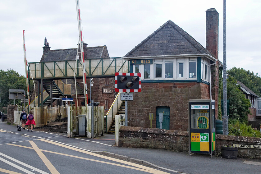 St. Bees signal box (Furness, 1891) & station 
 I have numerous photographs of St. Bees' superb Furness signal box. I make no excuses for capturing the 1891 structure again as it is such a superb building that is surely on borrowed time now. This design is characteristically robust and built in local stone with a lovely pyramidal hip roof. Notice the wooden sign on the front of the former station building that is now in use as a guest house. 
 Keywords: St. Bees signal box Furness 1891 station