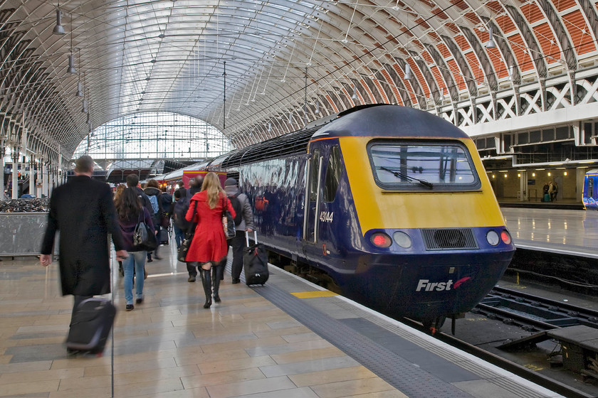 43144, GW 14.30 London Paddington-Weston-super-Mare (1C18), London Paddington station 
 Passengers make their way to their train in the form of the 14.30 Paddington to Weston-super-Mare at platform seven of the London terminus. First Great Western's 43144 will power the rear of the train running as 1C18 to the Somerset seaside resort. As part of set 253037 this power car was introduced to supplement the Western Region's HST provision as they opened up services to the far West Country from 1979 onwards. 
 Keywords: 43144 14.30 London Paddington-Weston-super-Mare 1C18 London Paddington station first Great Western HST