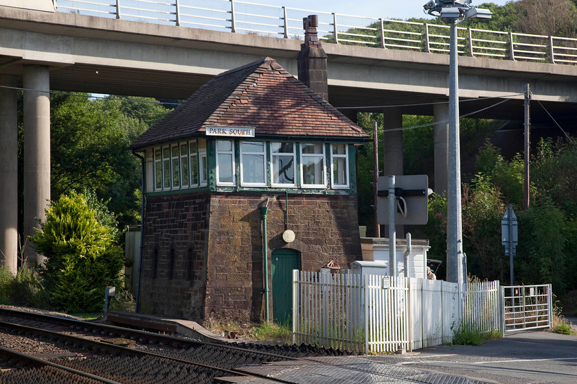 Park South signal box (Furness, 1883) 
 Park South signal box is dominated by the viaduct of the A590 Dalton bypass. This substantially built signal box was constructed by the Furness Railway in 1883 and is typical of the type that they constructed. It contains a second-hand 24 lever frame that came out of the nearby Coniston Station box when it was closed, along with the rest of the delightful branch of the same name, in 1962. 
 Keywords: Park South signal box