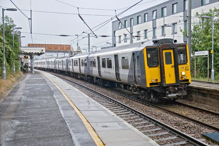 317504 & 317661, LE 10.21 Cambridge-London Liverpool Street (2H23), Whittlesford Parkway station 
 The 10.21 Cambridge to Liverpool Street Greater Anglia service arrives at Whittlesford Parkway station. Whittlesford station became designated as a Parkway station in 2007 with the completion of a large car park a short distance from the station. 
 Keywords: 317504 317661 10.21 Cambridge-London Liverpool Street 2H23 Whittlesford Parkway station Abellio Greater Anglia