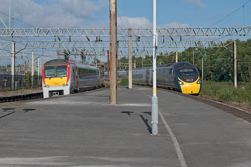 175011, AW 17.39 Liverpool Lime Street-Wrexham General (1B01, 1E) & 390050, VT 15.07 London Euston-Liverpool Lime Street (1F19, 27L), Edge Hill station 
 To the left 175011 passes away through Edge Hill station working ATW's 17.39 Liverpool Lime Street to Wrexham General station. Meanwhile, to the right, Avanti's 390050 slowly approaches working the 15.07 Euston to Liverpool Lime Street service. Notice the mothballed tracks to the extreme right of the photograph. These lines lead down to the Crown Street, Wapping and Stephenson's tunnels that predate the present-day route down to Lime Street. 
 Keywords: 175011 17.39 Liverpool Lime Street-Wrexham General 1B01 390050 15.07 London Euston-Liverpool Lime Street 1F19 Edge Hill station