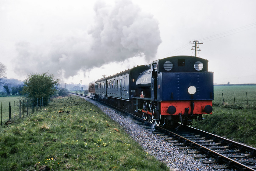 196, 12.30 New Alresford-Ropley, Bishop's Sutton SU605326 
 196 'Errol Lonsdale' heads the 12.30 New Alresford to Ropley service near to the Hampshire village of Bishop's Sutton. I do not particularly like tender first photographs but these locomotives were designed to be equally as effective working in both directions. 196 never actually worked for British Railways, being owned by the Ministry of Defence from new for training purposes at the Longmoor Military Railway. 196's main claim to fame was that it was the locomotive that starred, along with Frankie Howard, George Cole and Terry Scott, in the 1966 film 'The Great St Trinian's Train Robbery'. 
 Keywords: 196 12.30 New Alresford-Ropley Bishop's Sutton SU605326 Watercress Line Mid Hanst Railway Errol Lonsdale