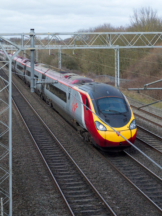 390135, VT 10.37 Manchester Picadilly-London Euston (1A12, 5E), Bradwell SP831391 
 390135 'City of Lancaster' passes Bradwell in Milton Keynes working the 10.37 Manchester Piccadilly to Euston 1A12 service. This image emphasises how tricky it is to take pictures at this location! 
 Keywords: 390135 1A12 Bradwell SP83139