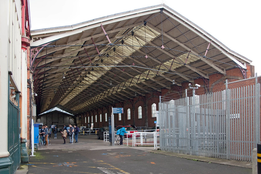 Brunel train shed, Bristol Temple Meads station 
 A view looking from the entrance of Brunel's 1840 broad gauge train shed at Bristol Temple Meads. This is not its full length, it extended beyond the participation wall at the end to where the main building and grand facade are located now on Temple Gate. Behind the fencing to the right of this image is the Bristol PSB that was opened in 1971 and is now in the process of being shut. It will eventually be demolished allowing the exciting prospect of trains having access to the train shed once again. 
 Keywords: Brunel train shed Bristol Temple Meads station.