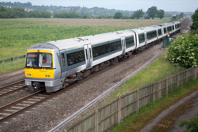 168001, CH 06.37 Kidderminster-London Marylebone (1H07), Warkworth SP476394 
 168001 leads a classmate forming the 06.37 Kidderminster to Marylebone 1H07 working. The picture is taken from the M40 motorway embankment with the town of Banbury in the background 
 Keywords: 168001 06.37 Kidderminster-London Marylebone 1H07 Warkworth SP476394