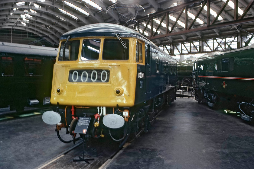 84001, on-display, National Railway Museum, York 
 During this visit to the NRM in 1979, 84001 had only been withdrawn for seven months! Still in its BR livery with the headcode panel displaying 0000, it sits in the main hall of the museum where it had arrived on 08.05.79 on loan for the NRM's 100 Years of Electric Railways exhibition. It then spent the rest of its time at Barrow Hill being taken to various open days. Until 2012, it was in the care of the AC Locomotive Society. 
 Keywords: 84001 on-display National Railway Museum, York