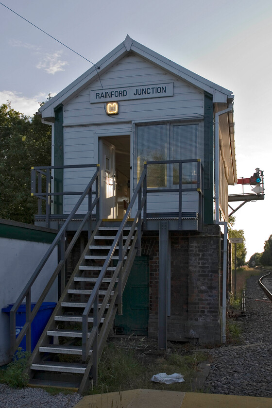 Rainford Junction signal box (LMS, 1933 on S&F base, 1874) 
 After getting friendly with the signalman at Rainford Junction, who also permitted us access to the box, he also said that we could go trackside to take our photographs. The box is an LMS structure dating from 1933 that sits on top of an 1874 Saxby and Farmer base. It has a fifty-six lever frame still in situ but just ten are still in use. It operates on a twin token system with one for passenger services and the other for freight trains. The latter token unlocks the ground frame at Dale that permits access to Knowsley Freight Terminal with the token able to lock the ground frame again permitting passenger services to pass over the single line section on the other token. 
 Keywords: Rainford Junction signal box LMS, 1933 on S&F base