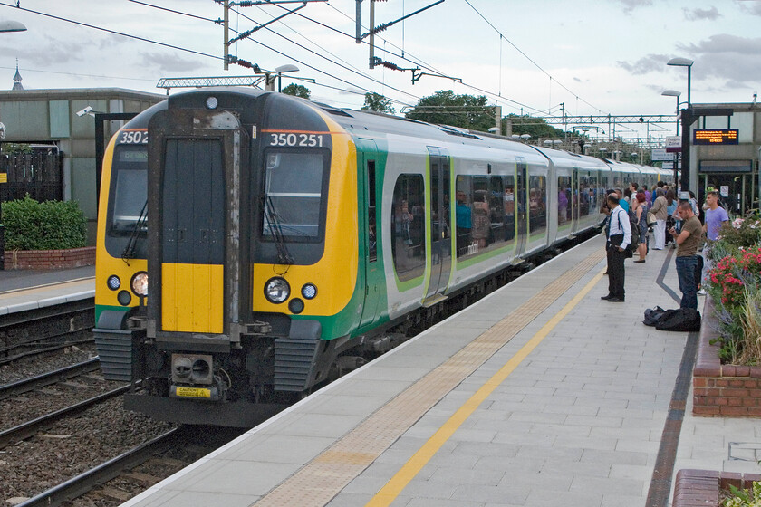 350251, LM 18.34 London Euston-Birmingham New Street, Watford Junction station 
 Having alighted from our terminating Southern service at Watford Junction we have changed platforms. The second train of our journey home arrives worked by 350251, the 18.34 Euston to Birmingham New Street London Midland service. We took this train as far as Milton Keynes where we had left the car earlier in the morning. 
 Keywords: 350251 18.34 London Euston-Birmingham New Street Watford Junction station London Midland Desiro