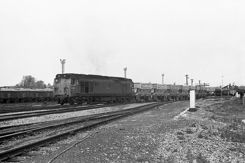 50033, down Foster Yeoman empty stone working, Westbury South 
 50033 'Glorious' leads a Foster Yeoman empty stone train out of Westbury past South Junction heading for one of the Mendip quarries. It was unusual to see a class 50 on one of these workings, hence why I chased the train to this spot, having already seen it entering Westbury station a little earlier. The flat area of cleared land to the middle right of the picture was where Westbury South signal box was located until it was decommissioned seven months prior to this picture being taken. It was demolished quickly following the introduction of the Westbury South MAS scheme and there appears to be no sign it was actually there. 
 Keywords: 50033 Foster Yeoman empty stone Westbury South