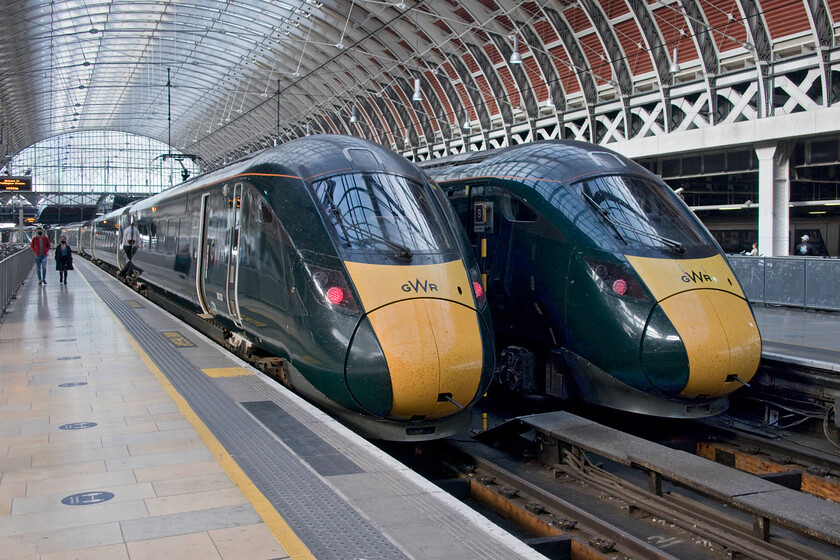 802028, GW 10.56 Swansea-London Paddington (1L18, RT) & 800312, GW 14.36 London Paddington-Plymouth (1C85, 2E), London Paddington station 
 Standing side by side on the blocks at Paddington station two GWR IETs are seen. To the left, 802028 has recently arrived working the 10.56 from Swansea whist to the right 800312 will work the 1C85 14.36 to Plymouth. 
 Keywords: 802028 10.56 Swansea-London Paddington 1L18 800312 14.36 London Paddington-Plymouth 1C85 London Paddington station