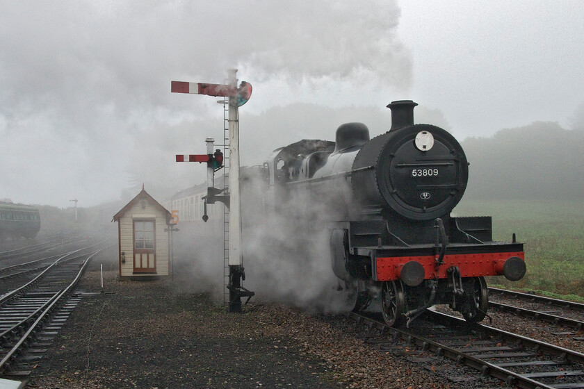 53809, 10.00 Sheringham-Holt, Weybourne station 
 On the final morning of our Norfolk holiday, 21st October 2022, the day dawned foggy and grey. I walked down to Weybourne station prior to our departure to capture the departure of the 10.00 Sheringham to Holt service seen here arriving at the station emerging from the murk! It is being led by former S & DR 7F 53809 which is drawing into the station 'wrong platform' in order to drop off various perishables for the station and its caf. 
 Keywords: 53809 10.00 Sheringham-Holt Weybourne station Somerset and Dorset 7F S&DR