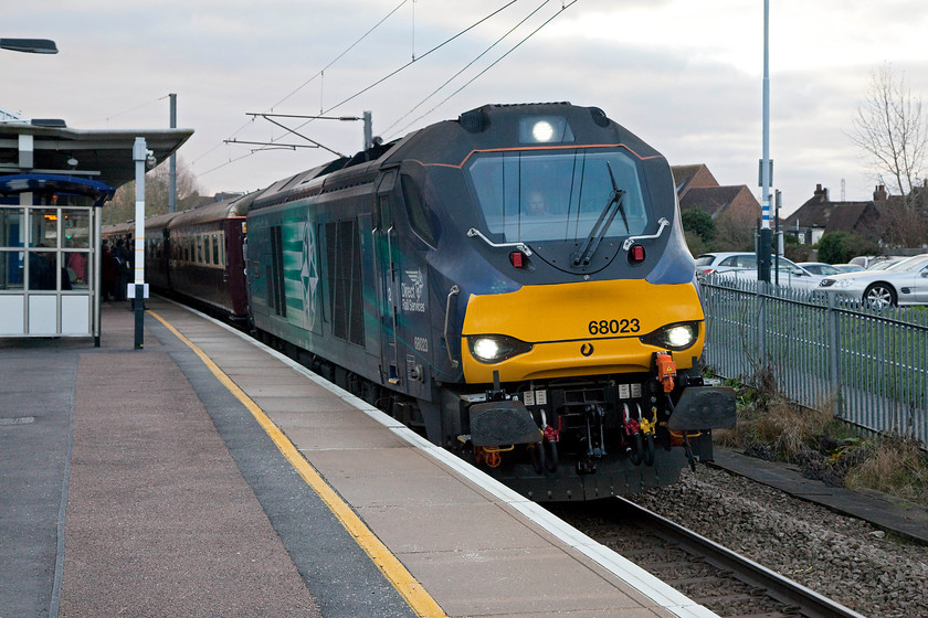 68023, outward leg of The Grassington Dickensian, 08.18 London King`s Cross-Skipton (1Z92), Potters Bar station 
 Having taken a local train from King's Cross to Potters Bar, I managed to beat The Grassington Dickensian railtour. Here, it stands at the station pausing to pick up passengers near to the start of its journey to Skipton running as 1Z92 with 68023 'Achilles' leading. 
 Keywords: 68023 The Grassington Dickensian 08.18 London King`s Cross-Skipton 1Z92 Potters Bar station