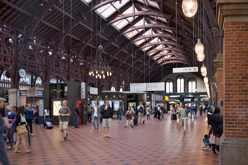 Concourse, Copenhagen Central station 
 The impressive concourse of Copenhagen Central station sits above the tracks at street level with access to the platforms in the right of this image down a series of escalators and steps. The station dates from 1911 being the work of the famed Danish architect Heinrich Wenck. As with many large stations, capacity is an issue and there are ambitious plans to expand the station by building more terminal platforms above the present ones entering straight into the concourse at this level. 
 Keywords: Concourse, Copenhagen Central station