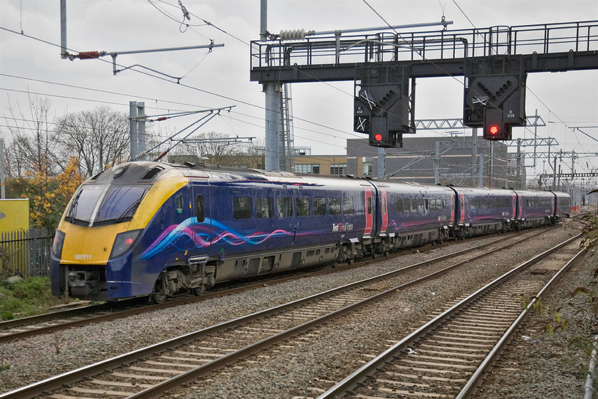 180111, HT 08.58 Bounds Green TMD-London KIng's Cross ECS (5H01), Alexandra Palace station 
 Having undergone servicing at Bounds Green depot Hull Trains' 180111 departs empty as the 08.58 5H01 to KIng's Cross. These Adelante Class 180s have been a bit like the hot potatoes of the railway world. They have transferred from TOC to TOC with notorious reliability issues never really dealt with properly so once they have entered service, they are managed as best as possible to then be passed swiftly on to somebody else! 
 Keywords: 180111 08.58 Bounds Green TMD-London KIng's Cross ECS 5H01 Alexandra Palace station Hull Trains Adelante