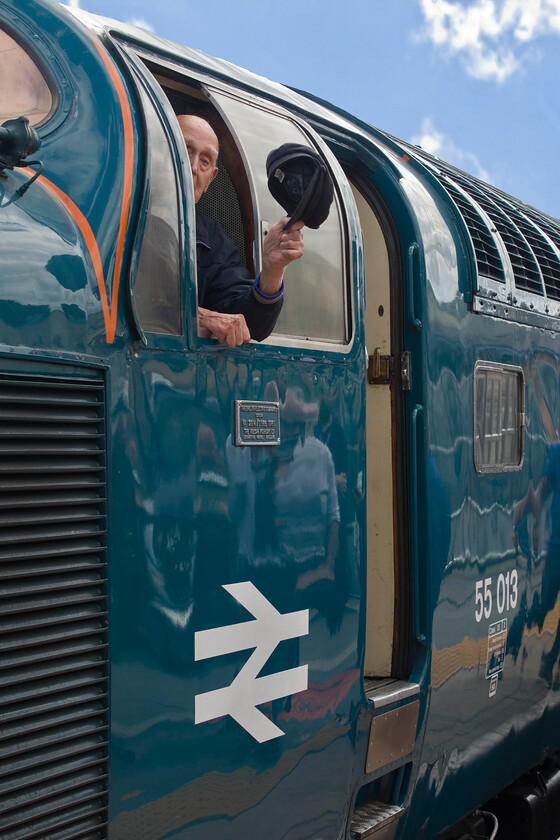 Harry Wilson, 55009 (55013), Scarborough station 
 Former Deltic driver Harry Wilson waves his hat from the cab window of 55009 'Alycidon' with its identity for the day altered to 55013 'The Balck Watch' (Harry's favourite Deltic) after arrival at Scarborough. Such as the interest in this event and surrounding the former driver that even the media covered the event, see.... https://uk.finance.yahoo.com/news/former-york-train-driver-gets-102325142.html 
 Keywords: Harry Wilson 55009 55013 Scarborough station The Black Watch Alycidon