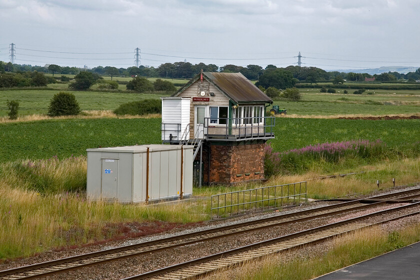 Salwick No. 2 signal box (L&Y, 1889) 
 Salwick No. 2 signal box is seen from the bridge that crosses the line near the station. The box was opened as Salwick in 1889 and contained a twenty-eight lever Railway Signal Company Limited tappet frame. The box was re-named Salwick No. 2 in 1942 with the opening of another box but it reverted to its initial name in 1975 nearly two years after the closure of Salwick No1 signal box. However, as can be seen, it still wears its British Railways (London Midland Region) enamel maroon enamel still proclaiming it to be No. 2 box! 
 Keywords: Salwick No. 2 signal box L&Y