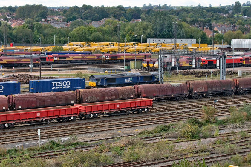 66305, 11.06 DIRFT-Doncaster iport (4E49, 3E), Toton yard 
 Just as we were returning to the parked car on the appropriately named Banks Road 66305 drifted slowly into the yard leading the 11.06 Daventry to Doncaster iPort 4E49 Tesco Express. This is my first photograph of this particular train but not of the locomotive that I have many images of around my home at Roade on the WCML near Northampton! 
 Keywords: 66305 11.06 DIRFT-Doncaster iport 4E49 Toton yard