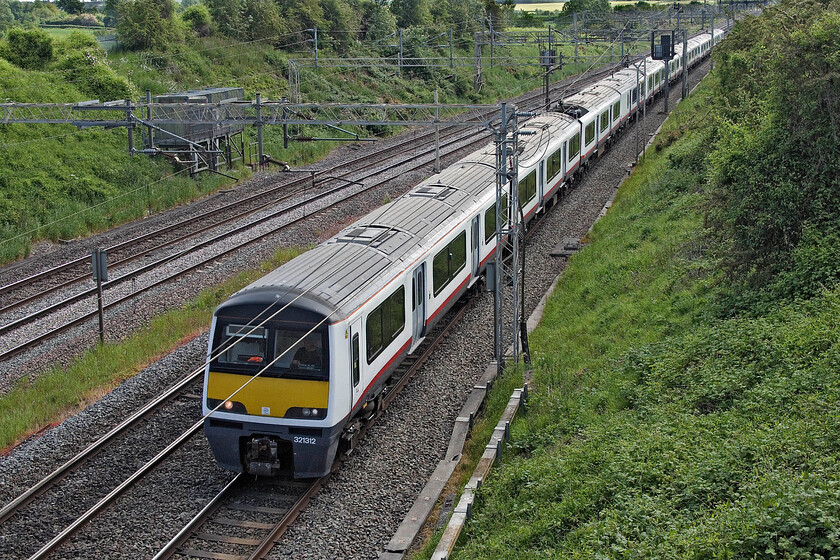 312312, 321307 & 321311, 10.00 Clacton CSD-Walton Old Junction Sidings (5Q35, 61E), Victoria bridge 
 After coming out of use with Greater Anglia the Class 321s (Dusty Bins to you and I!) are looking for further use or will face the prospect of scrapping. I am not too sure why 321312, 321307 and 321311 were heading to Warrington as the 5Q35 10.00 ex Clacton but I suspect not for scrap as it is unlikely that they would have run under their own power if that was the case. Due to it being a strike day the units were able to use the fast line here at Victoria bridge thus avoiding Northampton. 
 Keywords: 312312 321307 321311 10.00 Clacton CSD-Walton Old Junction Sidings 5Q35 Victoria bridge Dusty Bin