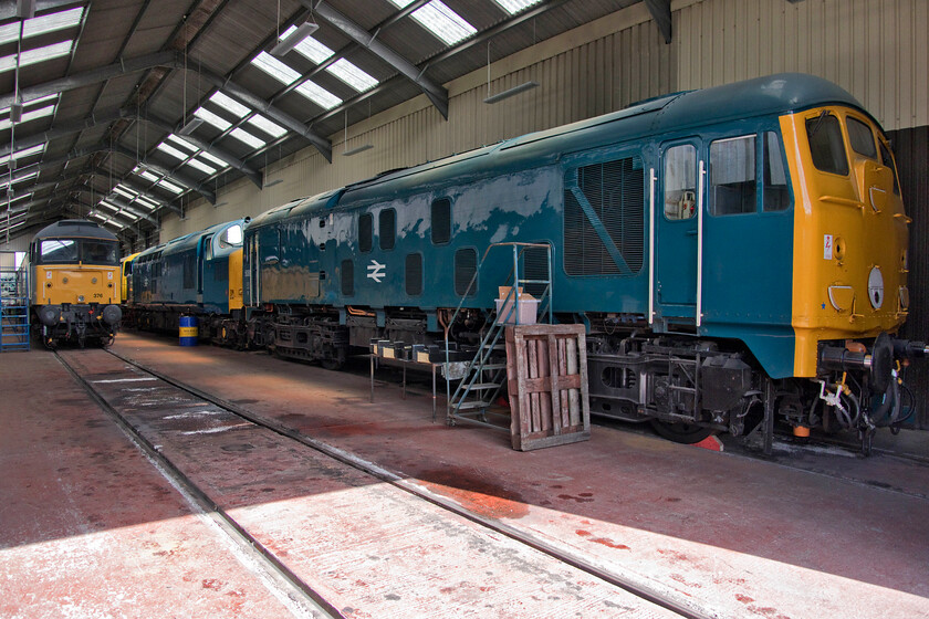 47376, 20228, 37215 & 5081, stabled, Toddington shed 
 Looking like a BR shed dating from the mid-1970s the large one at the Gloucestershire and Warwickshire Railway's Toddington headquarters is a lot cleaner and organised than those I remember visiting! In this scene, 5081 (24081) dominates with 37215 and 47376 also clear to see. Tucked in at the back is another of the railway's Type 1 residents, 20228 that is is due to enter service this year after some attention. I have photographed 24081 at a number of heritage railways over the years but probably my favourite photograph of it was back at a Crewe Works open day in 1979 when still under BR ownership, see.... https://www.ontheupfast.com/p/21936chg/27022042204/x24081-crewe-works 
 Keywords: 47376 20228 37215 5081 Toddington shed Gloucestershire and Warwickshire Railway