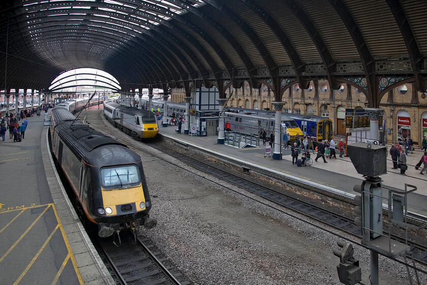 43468, GC 07.51 London King's Cross-Sunderland (1N90), 43315, GR 06.55 Edinburgh Waverley-London King's Cross (1E04), 91121, GR 10.01 York-London King's Cross (1Y82) & 158860 NT 10.27 York-Blackpool North (1B18), York station 
 A busy scene at York, taken from the station's footbridge, reveals all of the tracks in view occupied by a train with plenty of passengers and three operating companies represented.

From left to right......

43468, Grand Central's 1N90, 07.51 Sunderland to King's Cross
43315, East Coast's 1E04, 06.55 Edinburgh to King's Cross
91121, East Coast's 1Y82, 10.01 York to King's Cross
158860, Northern's 1B18, 10.27 York to Blackpool North 
 Keywords: 43468 07.51 London King's Cross-Sunderland 1N90 43315 06.55 Edinburgh Waverley-London King's Cross 1E04 91121 10.01 York-London King's Cross 1Y82 158860 10.27 York-Blackpool North 1B18 York station InterCity 225 East Coast Grand Central GC Northern HST