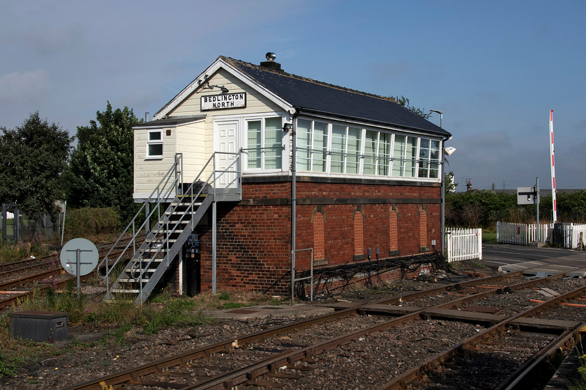 Bedlington North signal box (NE, 1912) 
 Bedlington North signal box sits in between two sections of double track controlling the junction, the signalling, and the level crossing. To the left, running behind the box, is the main access line into the complex of tracks directly from the ECML some five miles away at Morpeth. In the foreground, curving away to the right is the double-track leading to the former Alcan smelter and power station and the alumina import facility at North Blyth. The signal box is in smart condition only spoilt by the usual UPVC cladding being a NER structure dating from 1912. 
 Keywords: Bedlington North signal box