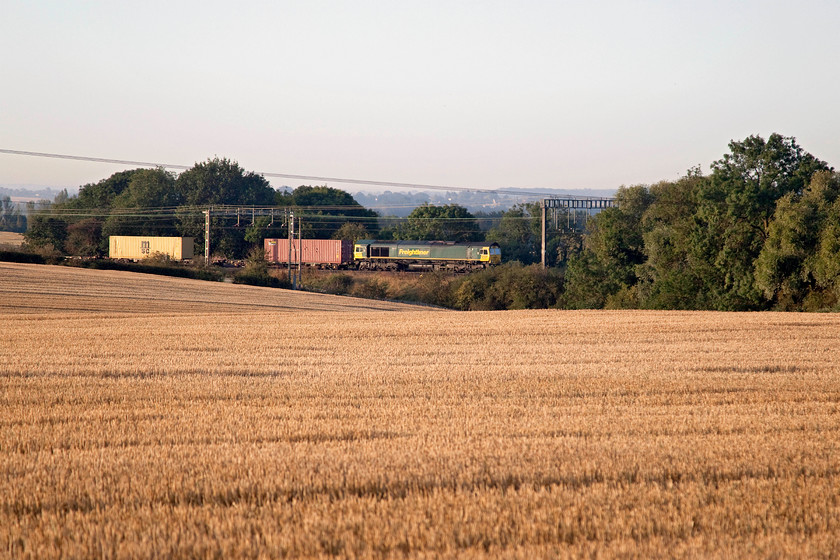 Class 66, 02.57 Felixstowe North-Garston (4M45), between Roade & Ashton 
 Just after sunrise between the villages of Roade and Ashton an unidentified class 66 leads the 02.57 Felixstowe to Garston Freightliner. I love the lighting at this time of year and at this time of day. It makes the effort of getting up early worth while! 
 Keywords: 02.57 Felixstowe North-Garston 4M45 Roade Ashton