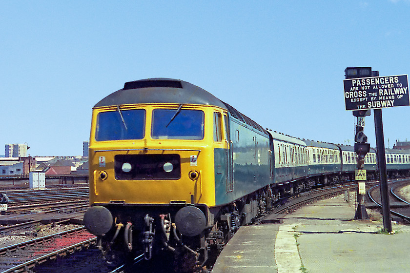 47191, unidentified down working, Bristol Temple Meads station 
 Looking very smart in the summer sun, 47191 arrives at Bristol Temple Meads with a down working composed entirely of Mk. 1 stock. Note the ex. GWR cast sign on the platform end now at quite a jaunty angle; I wonder where this ended up?