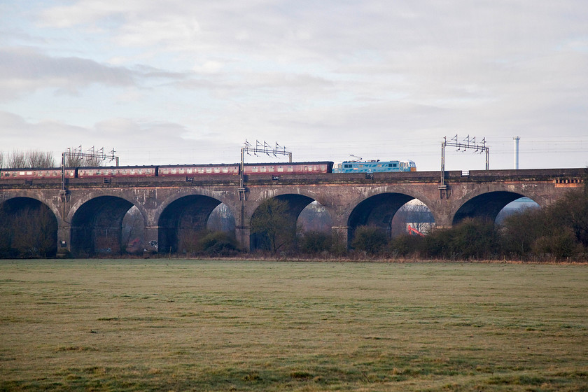 86259, outward leg of The Cumbrian Mountain Express, 7.10 London Euston-Carlisle (1Z86), Haversham SP818425 
 86259 'Peter Pan' or 'Les Ross' (you make up your mind!) crosses Haversham Viaduct near Wolverton with the outward leg of 'The Cumbrian Mountain Express' form London Euston to Carlisle. This regular winter working utilises this vintage electric power out and back with steam haulage, usually over the Settle and Carlisle, in between. A shame it was not in full sun but the light is good enough to create this nice picture. I was grateful to get back in the van and home for a warm breakfast! 
 Keywords: 86259 Les Ross Peter Pan The Cumbrian Mountain Express 07.10 London Euston-Carlisle (1Z86), Haversham